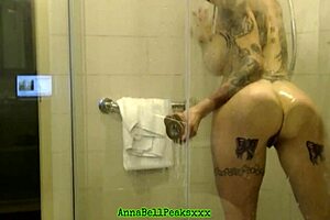 Hot tattoo milf teases in shower filming