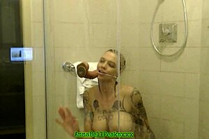 Hot tattoo milf teases in shower filming
