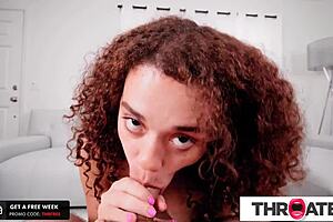 Ebony redheaded babe shoves cock deep down her throat!