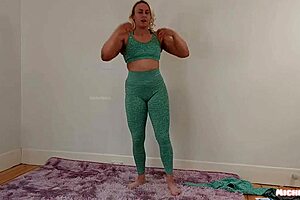 Fitness girl does a trial of tight yoga pants