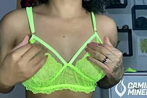She dances sultry, dark haired, and funky while teasing her curves