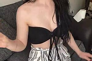 An old pretty teen smokes early in the morning while clothed.