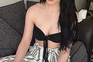 An old pretty teen smokes early in the morning while clothed.