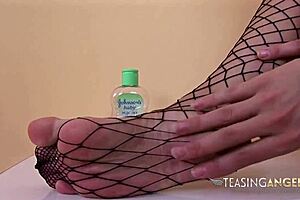 i watch this busty brunette bounce on a thick dildo in fishnet leggings