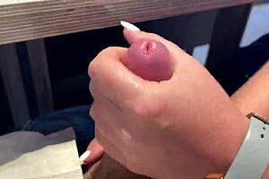 milf gives sloppy handjob in public