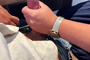 milf gives sloppy handjob in public