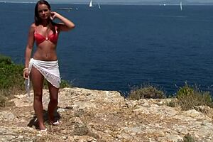 Chick In Bikini Strips Seductively By Cliff