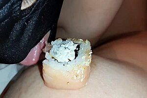 Two escorts lick sushi off my body in lesbian POV
