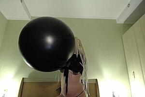 Tattooed Slut gets a huge balloon and pierces the balloon with her nails
