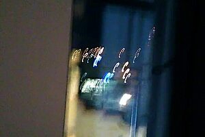 milf shows off by the hotel window