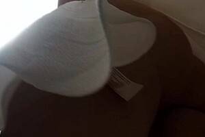 Lady in white dress reveals upskirt outdoors