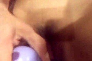 Big purple dildo slides into tight wet pussy