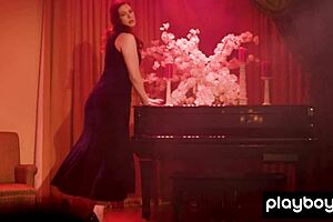 Glamorous australian redhead milf maitland ward performs a solo striptease on the piano, ripping her clothes.