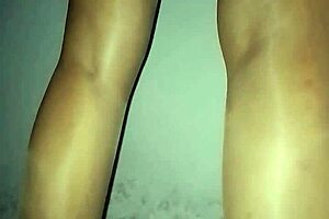 This mature woman in stockings cleans at night