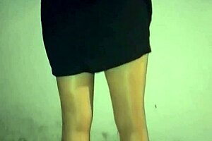 This mature woman in stockings cleans at night