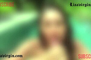 brunette giving blowjob in the pool