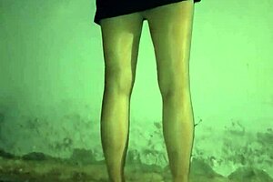 This mature woman in stockings cleans at night