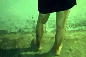 This mature woman in stockings cleans at night