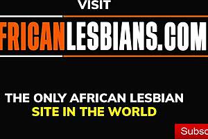 Hot black lesbian scissoring with strapon, licking bent over girlfriend's pussy