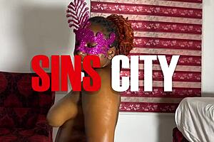 Ebony woman with big tits and ass fucks her big dildo in an orgy. She rides the toy passionately.