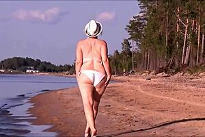 Juicy milf with a big ass in a white bikini