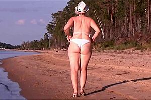 Juicy milf with a big ass in a white bikini