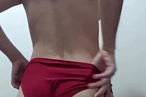 Young woman exposes her chest and strains herself to capture the scene