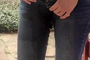 Redhead wife soaks jeans outdoors