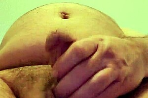 Masturbating on a tabletop on the floor in a hotel room
