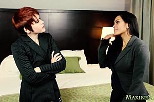 Chesty Maxine X and Lily Cade play with strap-on toys.