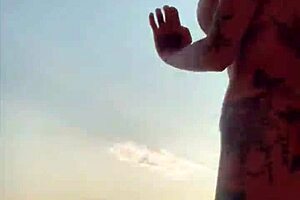 Shaking big tits while dancing naked in a steamy sauna