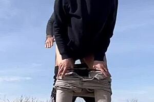 She gives a blowjob then bends over for doggystyle on the road.