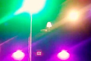 ning video footage of a stripper dancing in the knee high boots that she was wearing has her clothes torn off