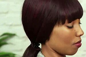 Ebony babe sucks and jerks in bondage threesome