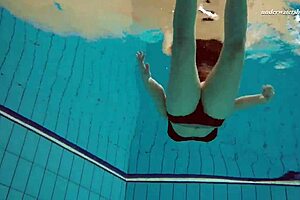 Hey, check out this underwater mermaid vesta as a horny teen 18+ splashing in the pool and beach with her bikini on, getting all wet in the shower too