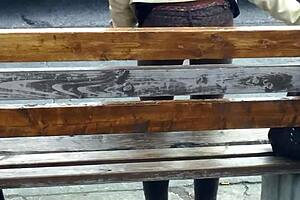 Slender beauty at bus stop public display