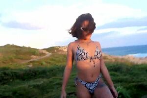 Couple's thrilling beach adventure turns passionate on rocks at Ilha Bela.