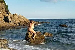 Latina Inserts Pebbles on Naked Public Beach