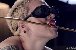 blonde slave in gas mask gets whipped, gagged, bound, and choked in kinky bondage