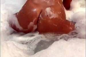 A sexually excited black girl dances in the shower