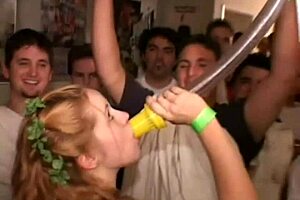 Intense dogging couple in action, watched by young partygoers