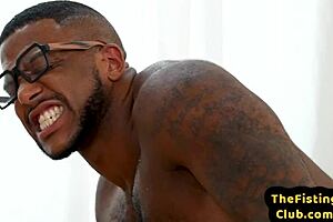 Interracial gay dudes fist each other's anal holes for satisfaction.