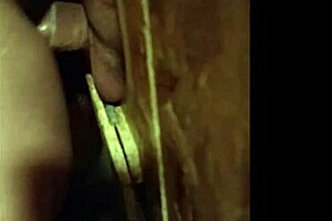 She gives oral at the glory hole, leading to creampie