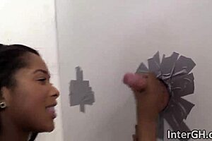 an ebony beauty narrates her interracial deepthroat adventure at the glory hole
