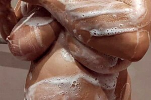 Stepbrother gropes wet boobs in shower while jerking off cock