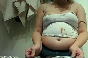 Hey, this chubby blonde slob is so messy with chocolate! 😋