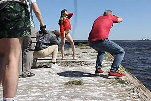 Naked Woman Poses Outdoors On Public Dock In Reality Video