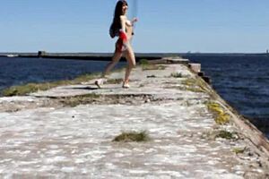 Naked Woman Poses Outdoors On Public Dock In Reality Video