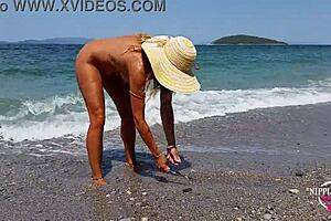 Nippleringlover mom shows extreme piercings on nude beach