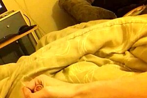 In the bedroom, he wanks his long thin cock to a massive cumshot